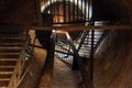 Rusty water tower inside view from top to bottom. Old water pump. Ladder to water tank, pigeon droppings Royalty Free Stock Photo