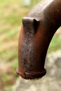 Rusty Waterpipe in a green background Royalty Free Stock Photo