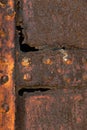 Rusty weathered metal texture with steel rivets background Royalty Free Stock Photo