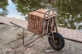 Rusty wheelbarrow with bricks, bricklayer tool isolated Royalty Free Stock Photo