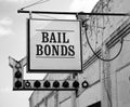 Aging Vintage Sign in Front of Small Town Bail Bonds Office Royalty Free Stock Photo