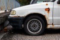 Rusty white Czech Skoda Felicia car damaged due to neglected care