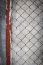 Rusty wire fence with cement wall grunge Royalty Free Stock Photo