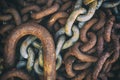 Rusty worn chain links in a pile Royalty Free Stock Photo