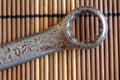 Rusty Wrench craftsman tool on wooden table, Spanner Tools collection, vintage style.