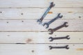 Rusty wrench on white wood Royalty Free Stock Photo