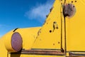 Rusty yellow antique truck with red turn signal Royalty Free Stock Photo