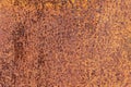 Rusty yellow-red textured metal surface. The texture of the metal sheet is prone to oxidation and corrosion. Grunge Royalty Free Stock Photo