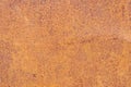 Rusty yellow-red textured metal surface. The texture of the metal sheet is prone to oxidation and corrosion. Grunge Royalty Free Stock Photo