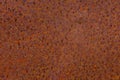 Rusty yellow-red textured metal surface. The texture of the metal sheet is prone to oxidation and corrosion. Grunge Royalty Free Stock Photo