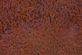 Rusty yellow-red textured metal surface. The texture of the metal sheet is prone to oxidation and corrosion. Grunge Royalty Free Stock Photo