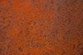 Rusty yellow-red textured metal surface. The texture of the metal sheet is prone to oxidation and corrosion. Grunge Royalty Free Stock Photo