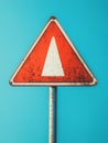 Rusty yield traffic sign against a blue sky. Royalty Free Stock Photo