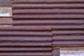 Rusty zinc corrugated iron metal siding for vintage background textured. Royalty Free Stock Photo