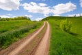 Rut road over green hill Royalty Free Stock Photo