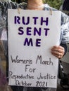 Ruth Sent Me sign held by woman in rain covering at March for Reproductive Justice