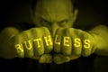 RUTHLESS written on an angry man fists Royalty Free Stock Photo