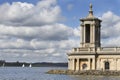 Church next to a lake in spring in Rutland Water Normaton church in United Kingdom Royalty Free Stock Photo