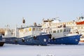 Tugboats and passenger vessel during wintering in the backwaters Royalty Free Stock Photo