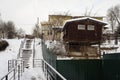 Rural house and stepway in the valley of Gorodyanka river in Ruza of Moscow region, Russia. Cloudy winter view.