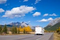 An RV aon the highway through the Canadian Rocky Mountains in Kananaskis, Alberta during the peak of autumn colors Royalty Free Stock Photo