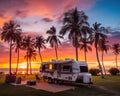 The RV caravan camper park is at the campground during sunset.