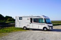 RV holiday trip in motorhome Caravan car Vacation with large Camper van parked aside sea coast beach Royalty Free Stock Photo