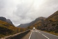 RV pick-up trailer on mountain road in Scotland Royalty Free Stock Photo