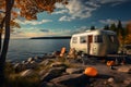 RV recreation vehicle parked next to lake during summer time