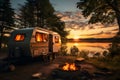 RV recreation vehicle parked next to lake during summer time