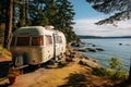 RV recreation vehicle parked next to lake during summer time