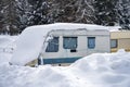 Rv trailer caravan roulotte covered by white snow