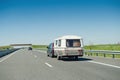 RV van and trailer driving fast to vacance destination