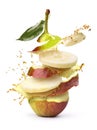 RW Pear shatters with juice on a white background