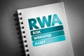 RWA - Risk Weighted Asset acronym on notepad, business concept background