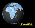 Rwanda on dark globe with blue world map.