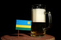 Rwanda flag with beer mug on black