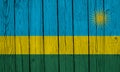 Rwanda Flag Over Wood Planks