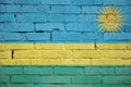 Rwanda flag is painted onto an old brick wall Royalty Free Stock Photo
