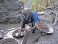 Rwandan Miner Panning For Precious Metals Royalty Free Stock Photo