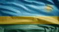 Rwandese flag waving in the wind. Close up of Rwanda banner blowing soft silk Royalty Free Stock Photo