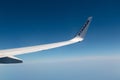 Ryanair airline wing in mid air above the clouds Royalty Free Stock Photo