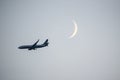 Ryanair airplane flying in the sky in front of moon Royalty Free Stock Photo