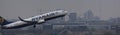 a ryanair airplane over the cityscape of berlin panorama