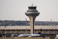 Ryanair airplane at Adolfo Suarez Madrid Barajas Airport passing by the air traffic control tower