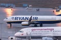 Ryanair and germanwings airplanes at ground cologne bonn airport germany in the rain