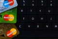 Ryazan, Russia - February 27, 2018: Few credit cards of Mastercard company over the black computer keyboard. Royalty Free Stock Photo