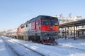 Passenger train with diesel locomotive TEP-70 on Rybinsk station