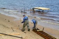 RYBINSK, RUSSIA. Workers prepare designs on construction of a pier in the Rybinsk reservoir. Yaroslavl region