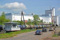 RYBINSK, RUSSIA. View of a railway crossing, a freight train with tanks and a grain elevator. Yaroslavl region Royalty Free Stock Photo